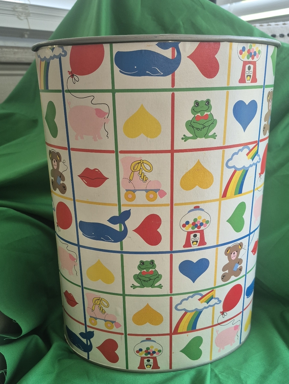 Vintage metal wastebasket featuring a whimsical grid pattern. Collectible 1980s